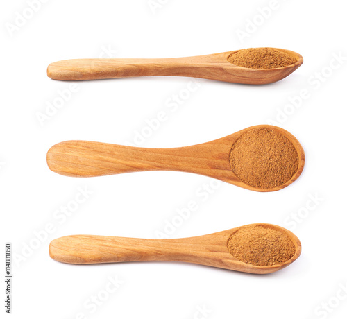 Wooden spoon full of cinnamon