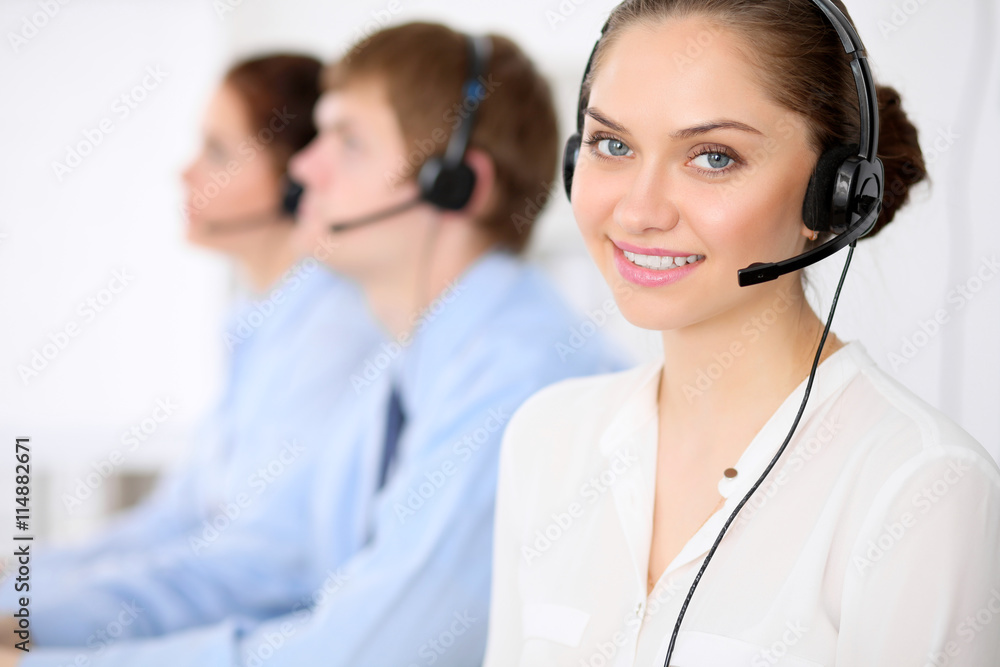 Call center operators. Young beautiful business woman in headset. Call center operators. Young beautiful business woman in headset.