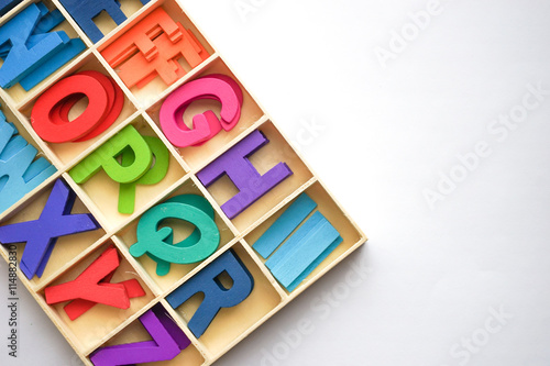 Colorful wooden letter with white background