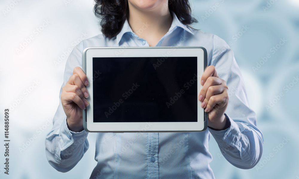 Woman use tablet device . Mixed media
