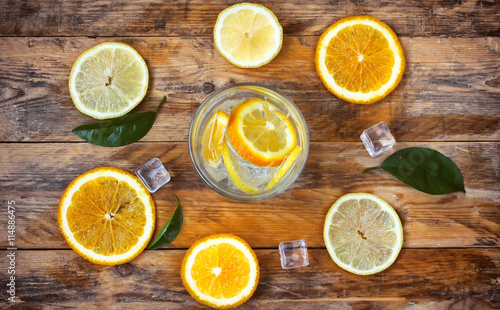 glass homemade lemonade, orange, lemon, ice cube