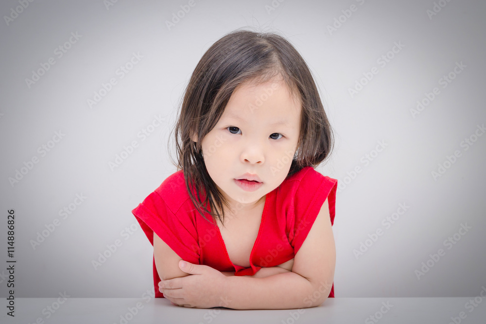 Young asian girl looking at camera