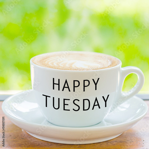 Fotografie Happy Tuesday on coffee cup over natural background