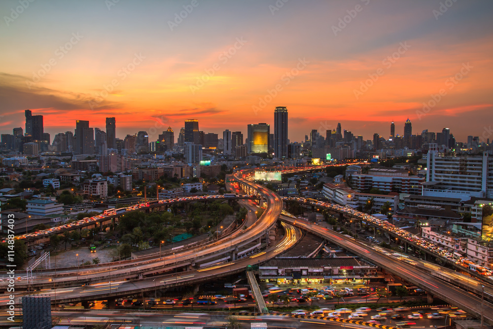 Top view of a freeway traffic jam .Panoramic and perspective wide angle high rise building skyscraper commercial city of future. Business concept of success industry tech architecture