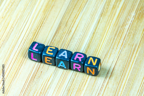 Colorful letter cube with bamboo texture surface. Educational co photo