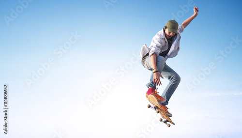 Skater on the sky background. Sport and active life concept photo