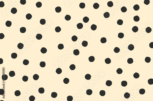 Hand drawn circle, polka dots in black on cream background