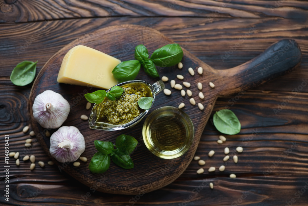 Ingredients for preparing pesto sauce in a rustic wooden setting Ingredients for preparing pesto sauce in a rustic wooden setting