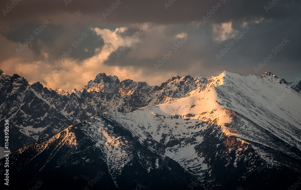 Fototapeta premium Cloudy Tatra mountains in the morning, covered with snow