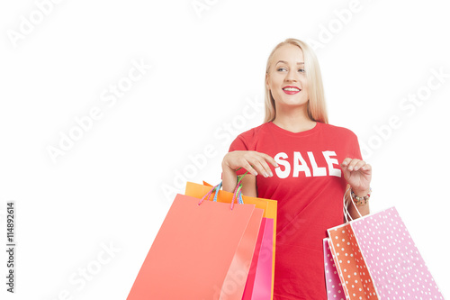 Portrait Of Young Woman Wearing perecentage symbol T-shirt Holding Shopping Bag on a white background