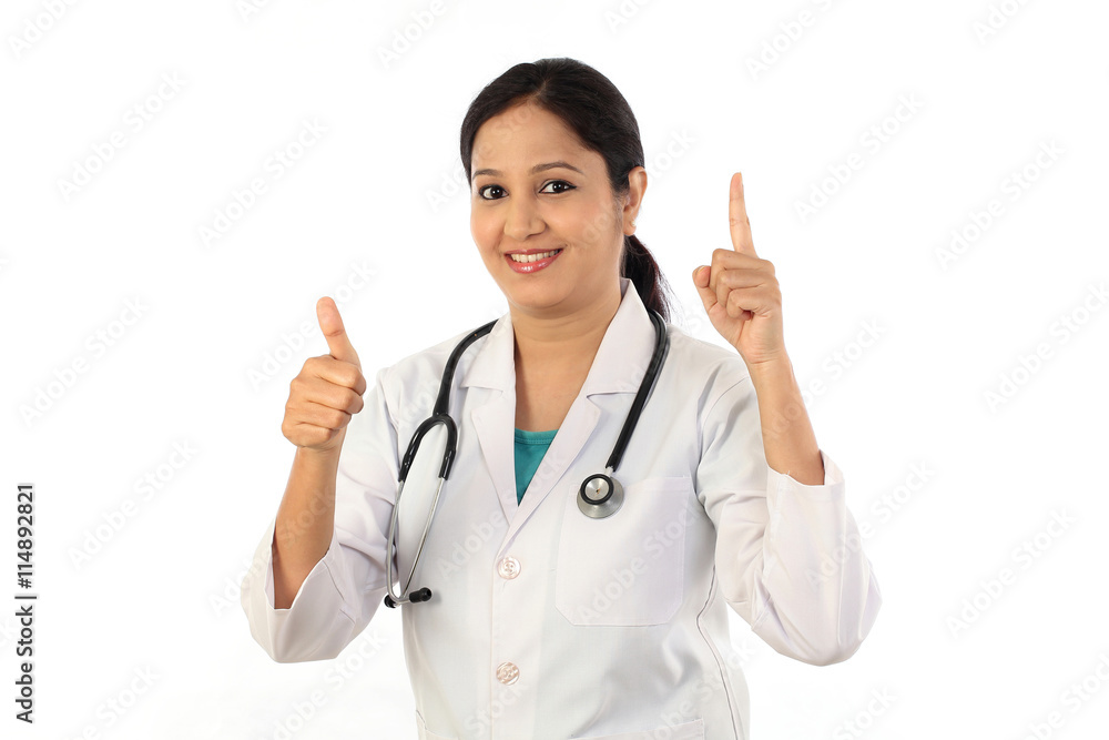Young female doctor with thumbs up gesture Young female doctor with thumbs up gesture
