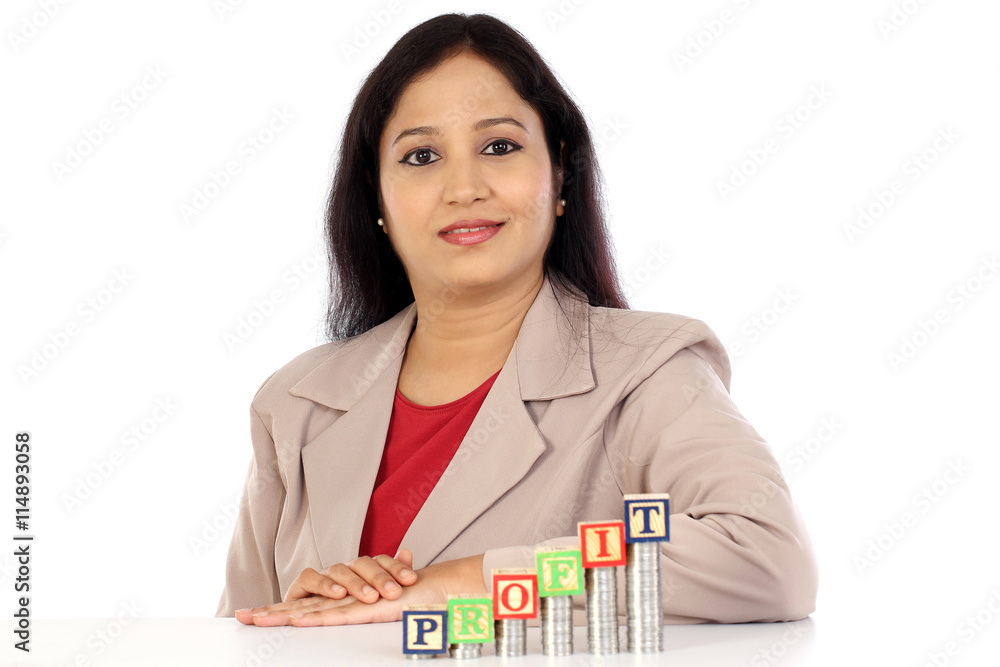 Successful business woman with stack of coins Successful business woman with stack of coins