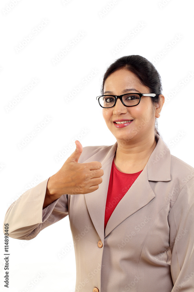 Young business woman with thumbs up gesture Young business woman with thumbs up gesture