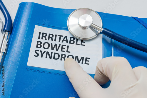 Blue folder with patient files with IBS (Irritable Bowel Syndrome) diagnosis.