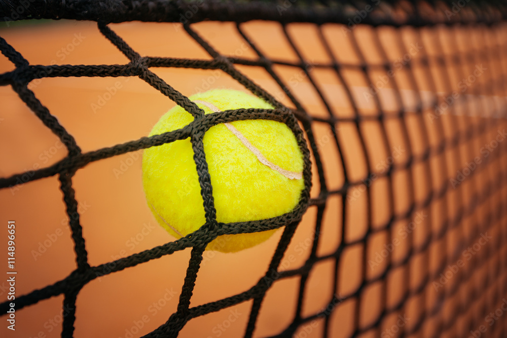 Tennis ball hitting the net foto de Stock Adobe Stock