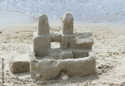 The sand castle on the seashore photo