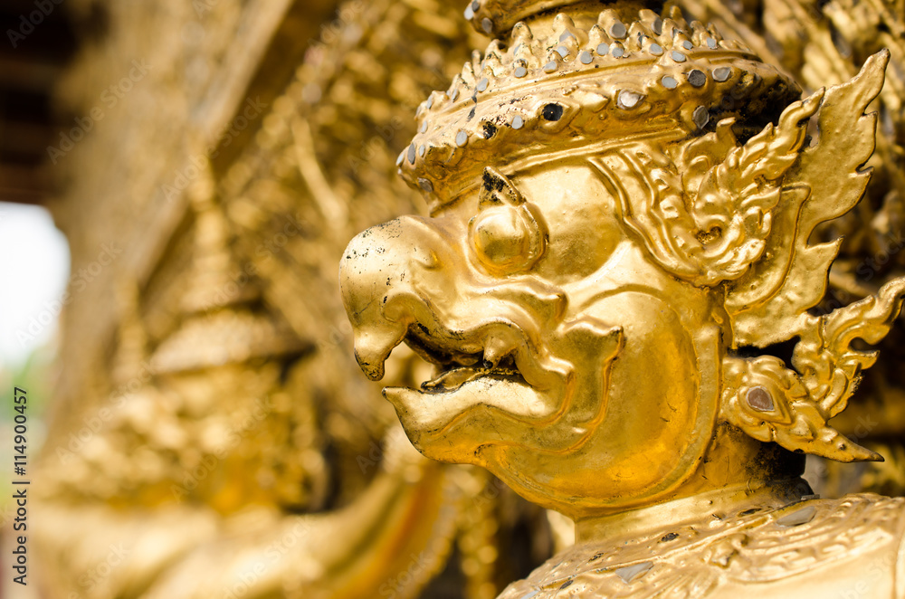 Golden garuda decoration on wall of The Emerald Buddha temple or 