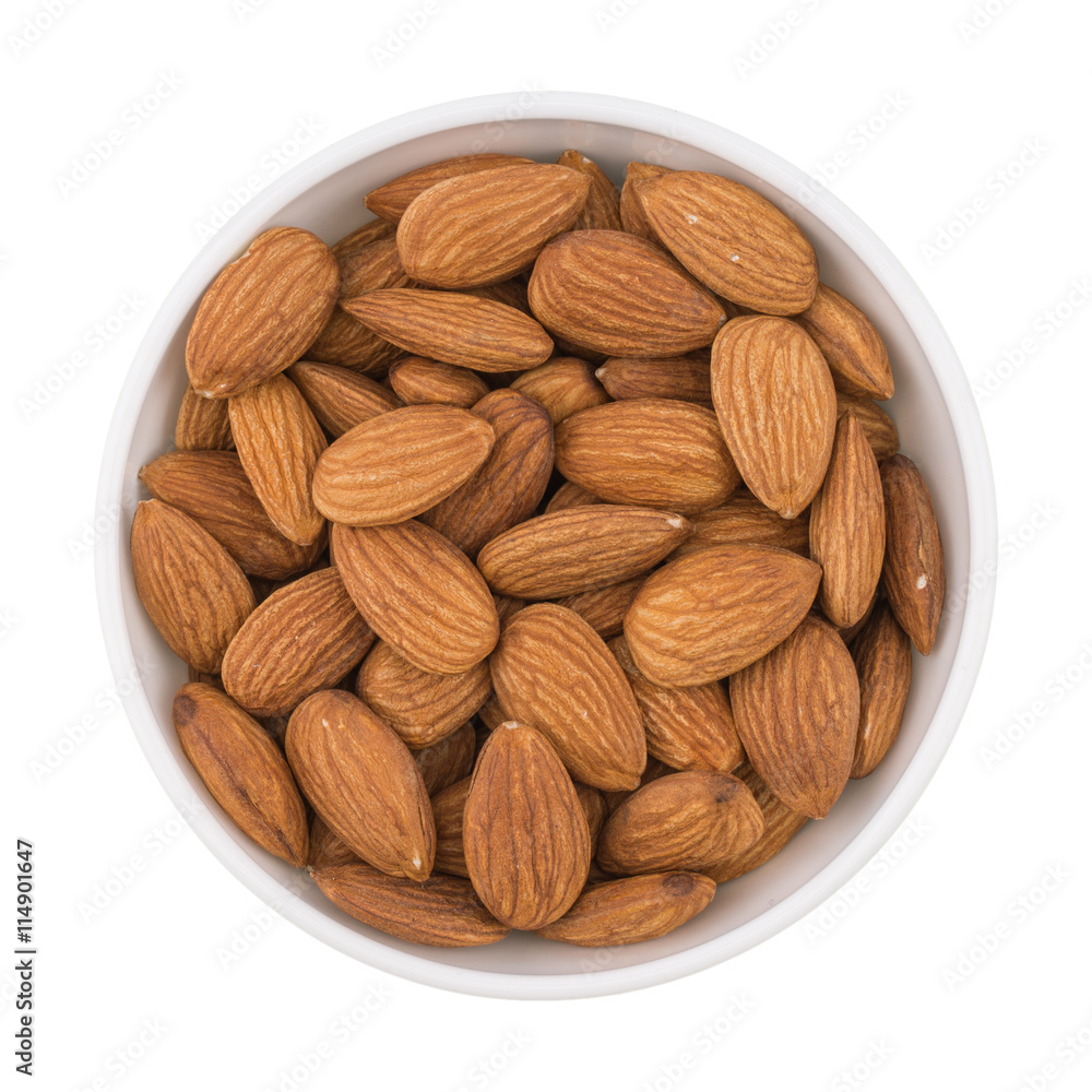 Almonds seed in the bowl isolated on white background. Almonds seed in the bowl isolated on white background.