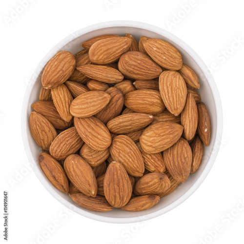 Almonds seed in the bowl isolated on white background.