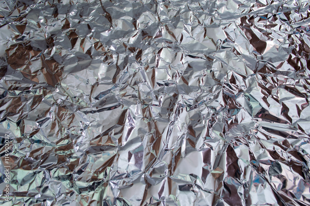 Silver crumpled foil texture pattern for background. Silver crumpled foil texture pattern for background.