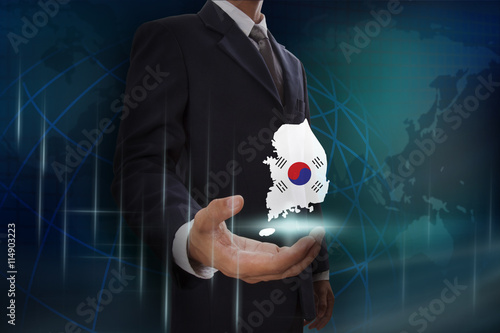 Businessman showing map of Australia on globe background