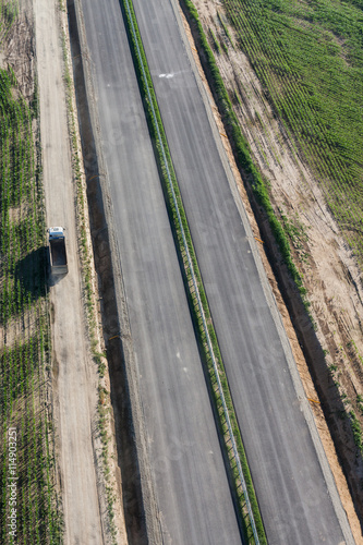 aerial view of the highway  and harvest fields