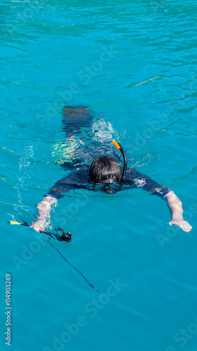 underwater hunter with a gun in a mask. speargun