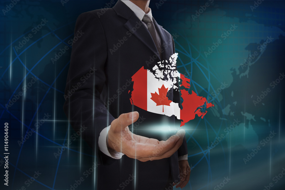 Businessman showing map of Canada on globe background