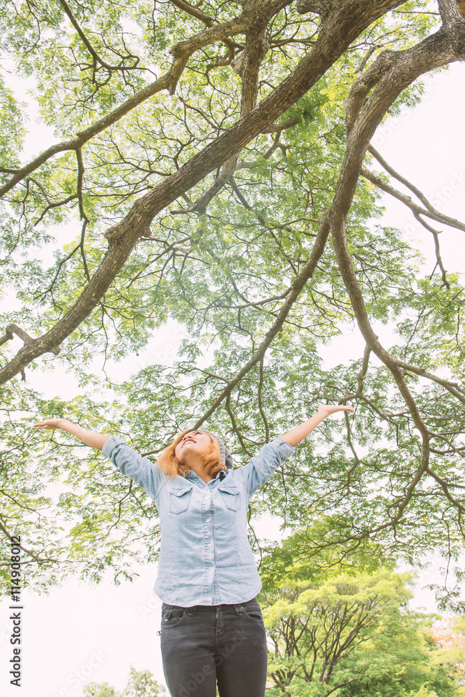 Fototapeta premium Young beautiful asian women stretch enjoying with fresh air in t