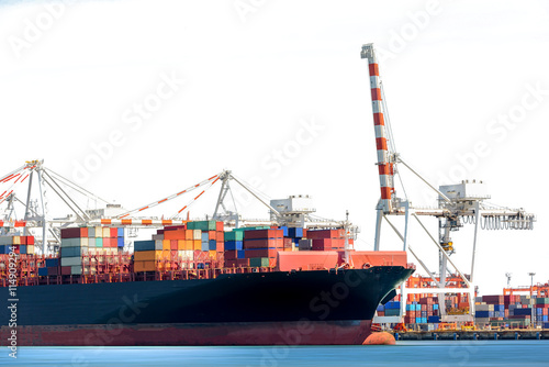 Container Cargo Ship with working crane bridge in shipyard isolated on white background, Freight Transportation, Logistic Import Export background.
