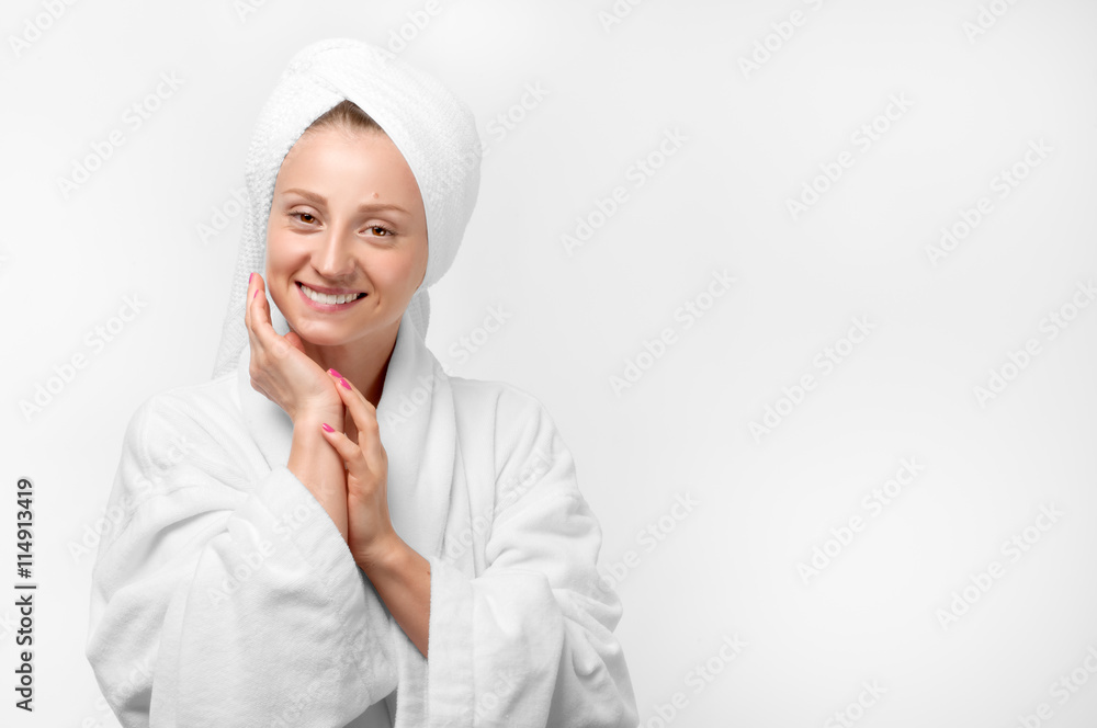 Beauty portrait of woman wearing a towel and white bathrobe Beauty portrait of woman wearing a towel and white bathrobe