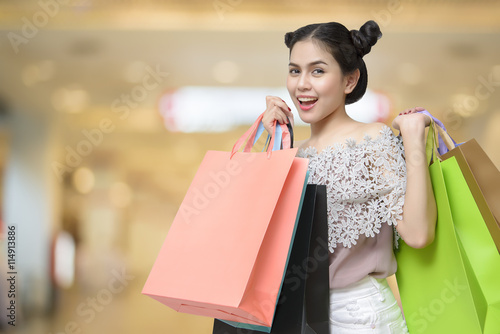 Attractive shopper woman holding shopping bags