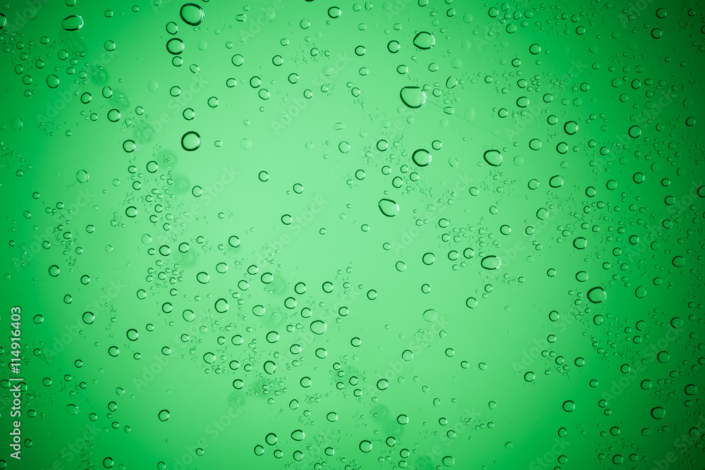 Raindrops on green glass, Water droplets on green glass for a ba