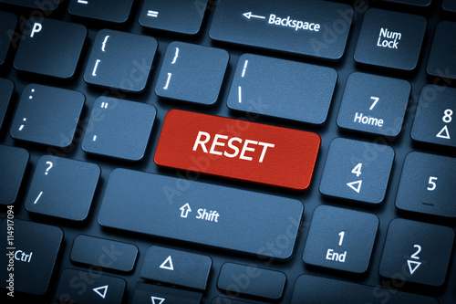 Laptop keyboard. The focus on the Reset key. photo