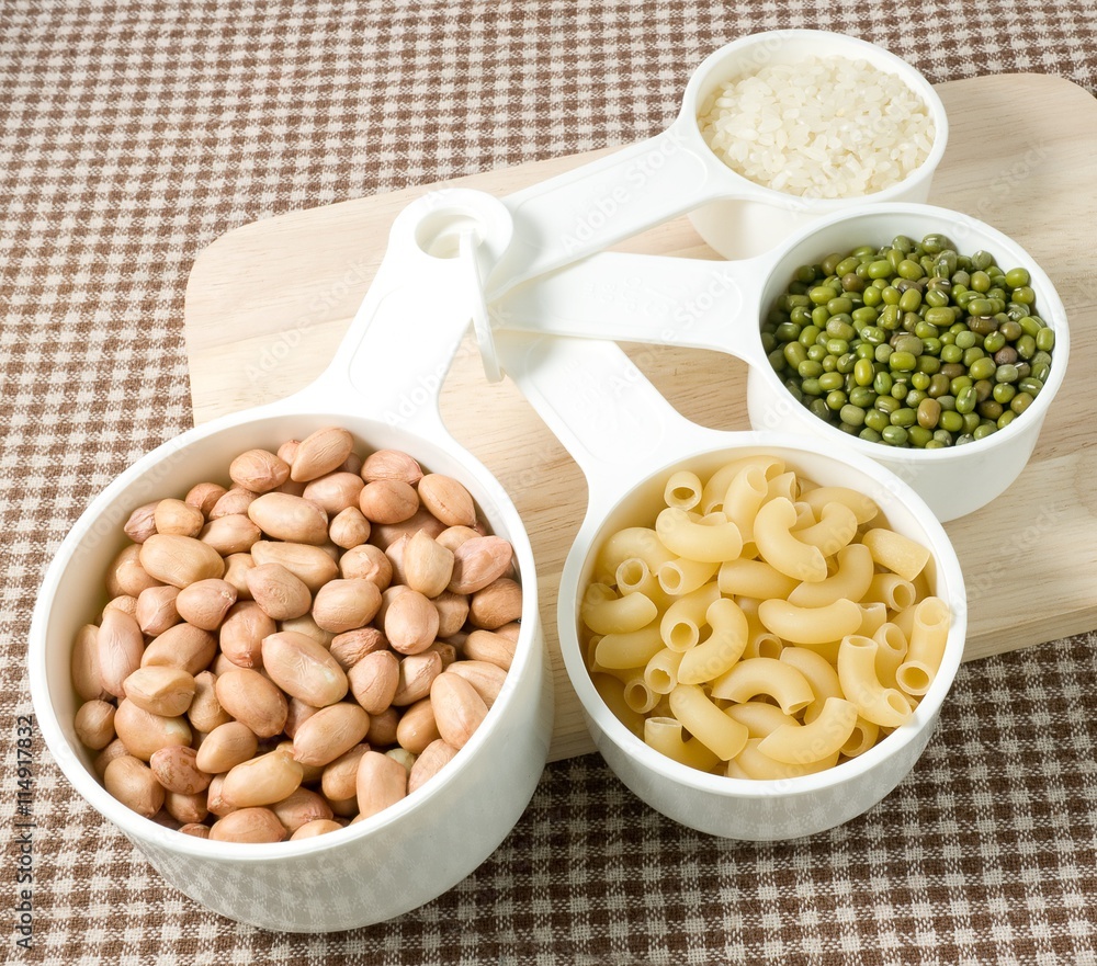 Pasta, Rice, Peanuts and Mung Beans in Measuring Spoons Pasta, Rice, Peanuts and Mung Beans in Measuring Spoons
