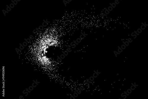 Abstract grainy texture isolated on black background. Silhouette of food flakes such as salt or almond or wheat flour spread on the flat surface or table. Top view. Dust, sand blow or bread crumbs.