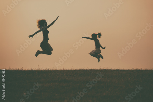 Mother and daughter enjoy spending time together outdoor.