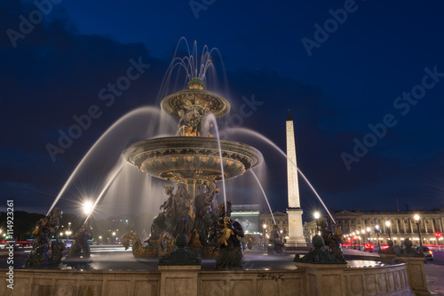 Obelisk of Luxor and fountain with water motion  at the Place de la Concorde in Paris at night © respiro888