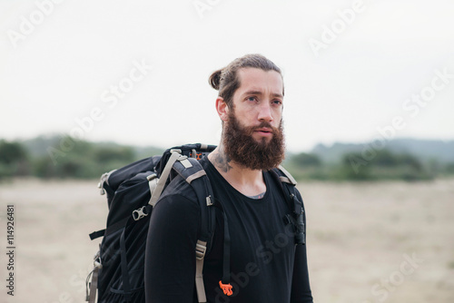 Hiker with beard outdoors © ysbrandcosijn