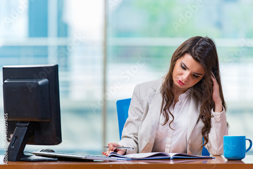 Businesswoman sitting at the office desk