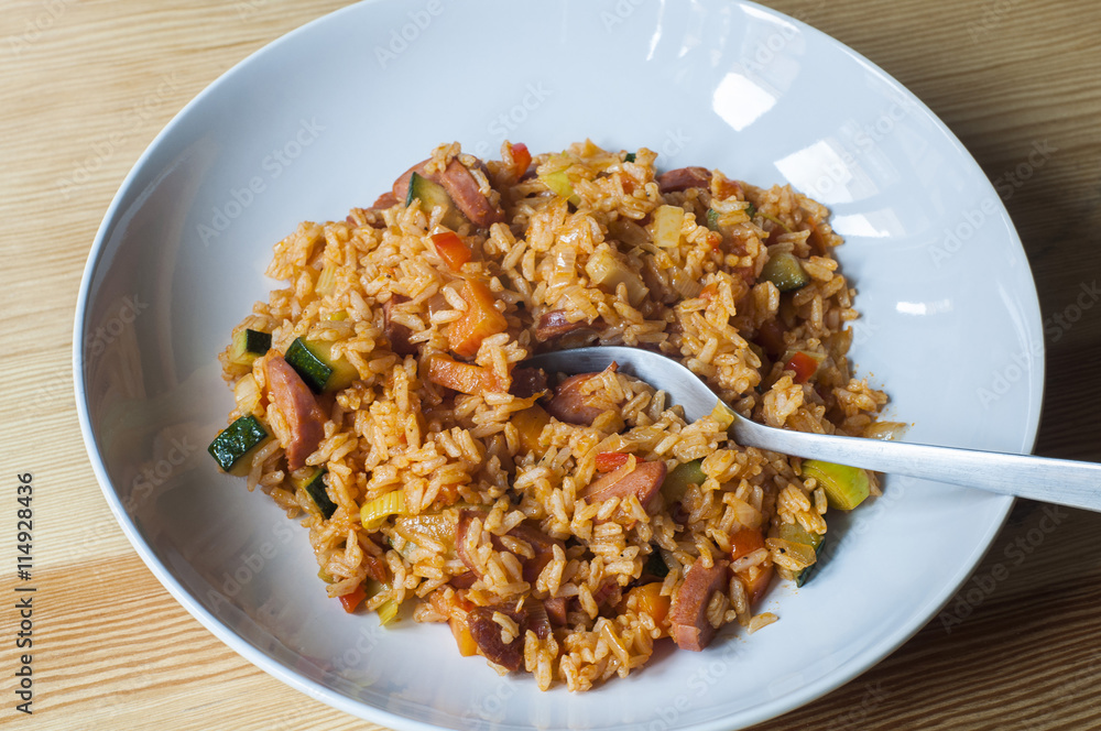 Delicious rice with stewed vegetables and sausages Delicious rice with stewed vegetables and sausages