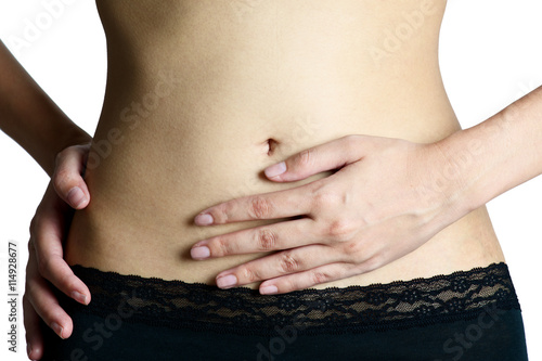 Woman holding her stomach on pain area, isolate on white background.