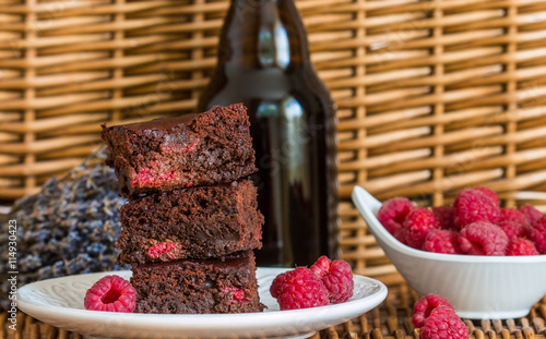 Chocolate brownie with raspberries and dark beer. Selective focus
 photo