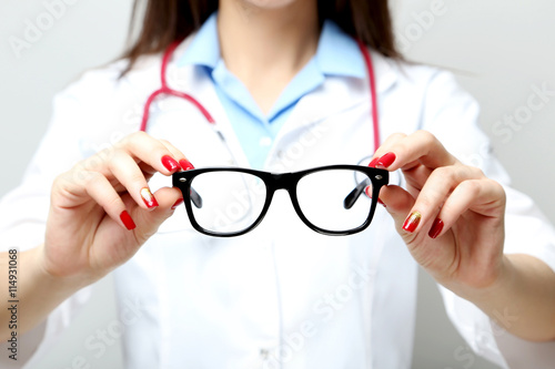 Medical doctor with a eyeglasses in the hands
