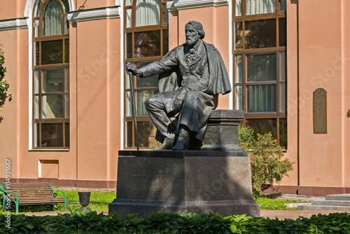 Monument to the famous Russian writer Ivan Sergeyevich Turgenev on Manezh square in Saint-Petersburg. photo