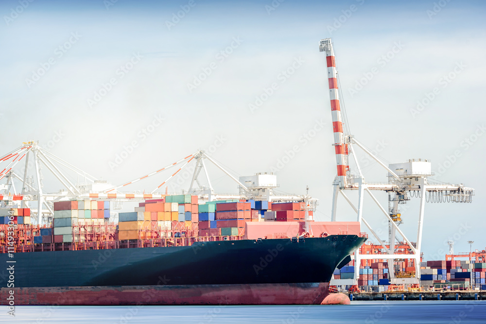 International Transportation Shipping, Container Cargo freight ship with ports crane bridge in harbor, Logistic Import Export background concept, un-mooring of containers cargo ship.