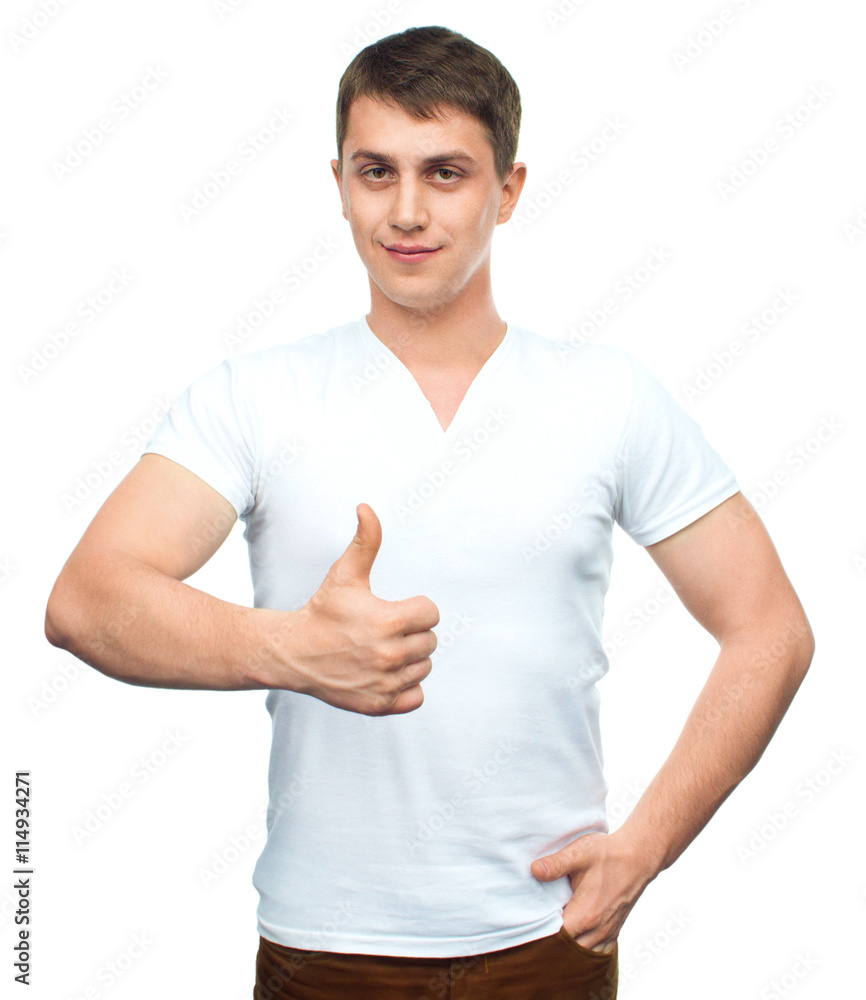 Young man shows thumb up gesture. Young man shows thumb up gesture.