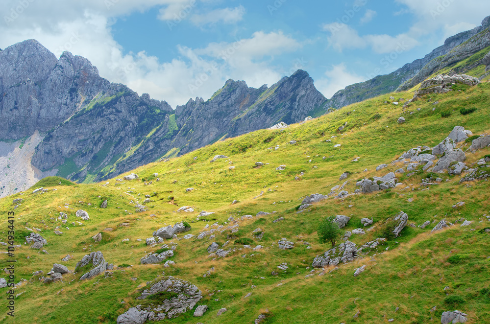 Fototapeta premium Montenegro, national park Durmitor, mountains and clouds. Sunlight lanscape.