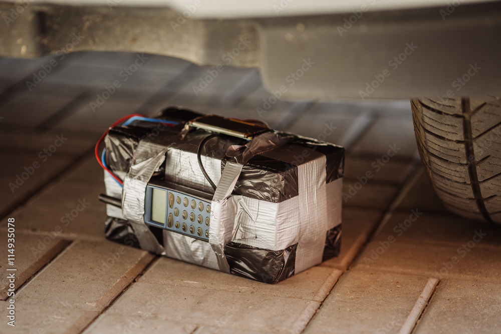 Fototapeta premium black bomb with radio control and digital countdown timer at the