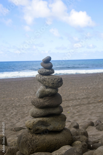 Lava rocks on black sand beach